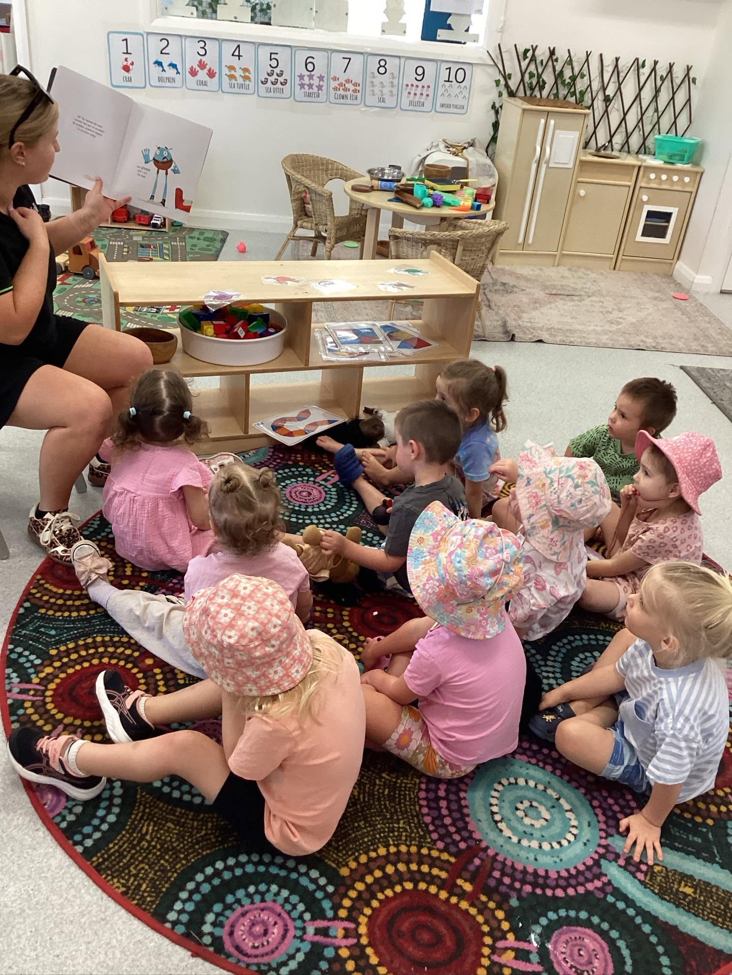 Educator supporting a young child through positive behaviour guidance