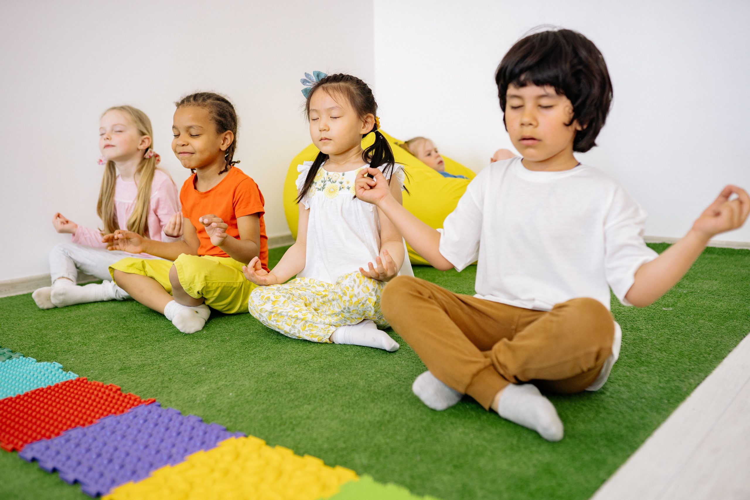 Children participating in yoga and meditation activities